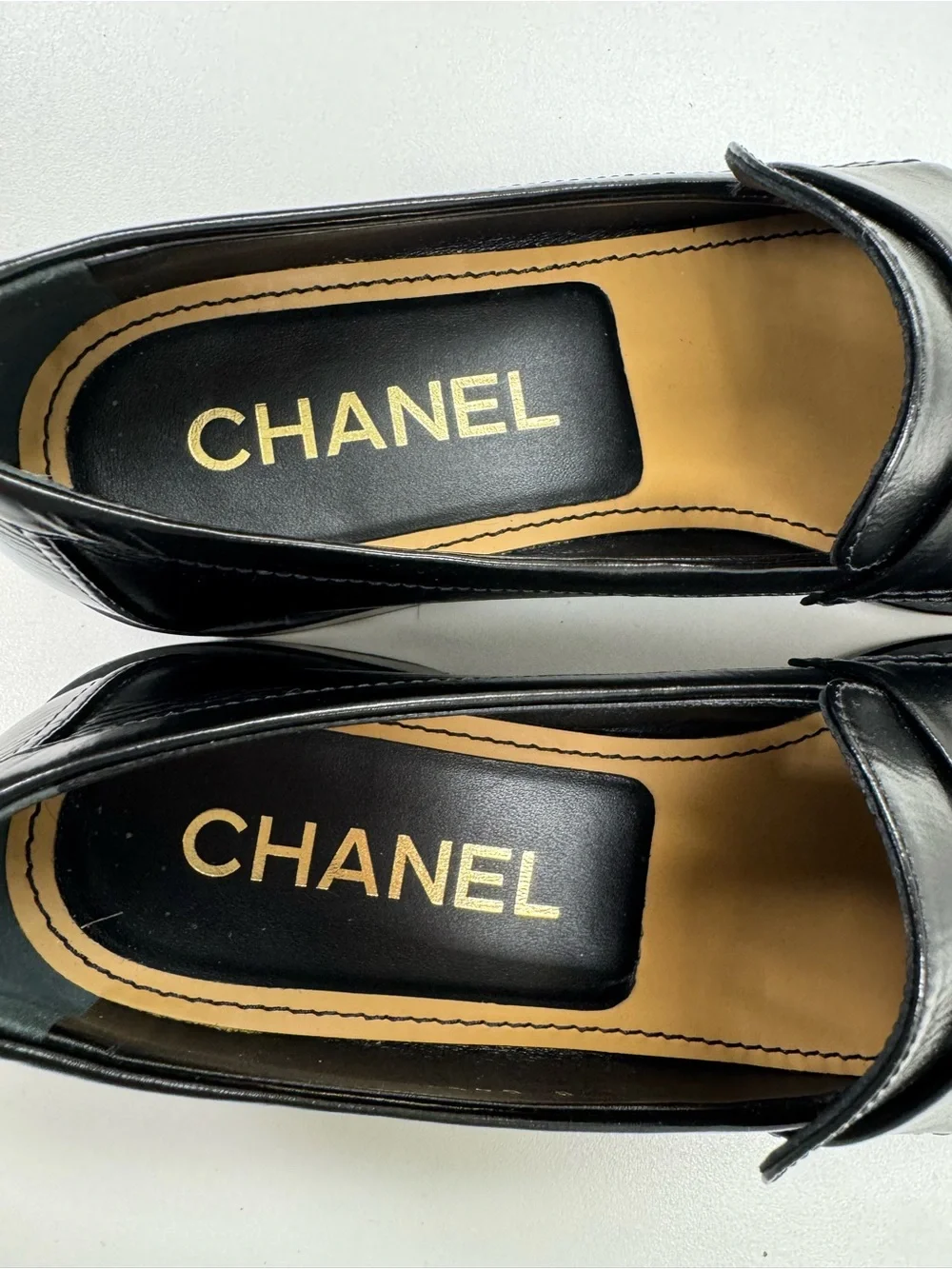 CHANEL Black Leather Loafers with Gold CC Medallions